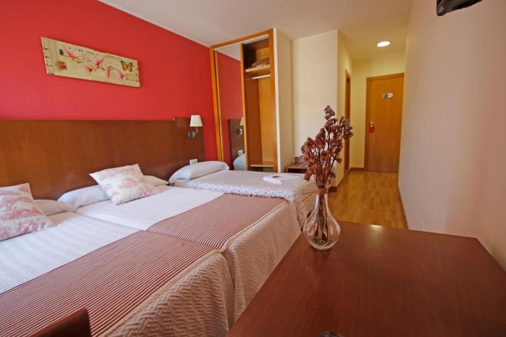 Postel nebo postele na pokoji v ubytování Villa de Colunga