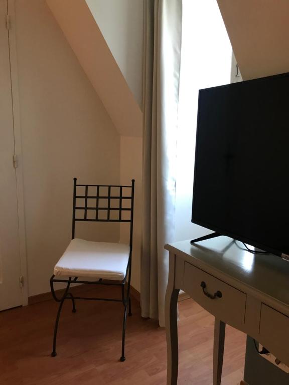 Telewizja i/lub zestaw kina domowego w obiekcie Les Mas du Peintre