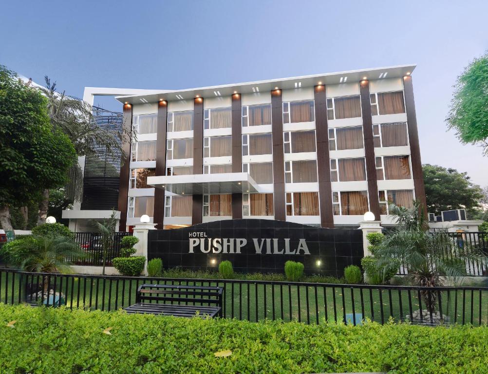 a building with a sign that reads pistip villa at Hotel Pushp Villa Agra Taj East Gate in Agra