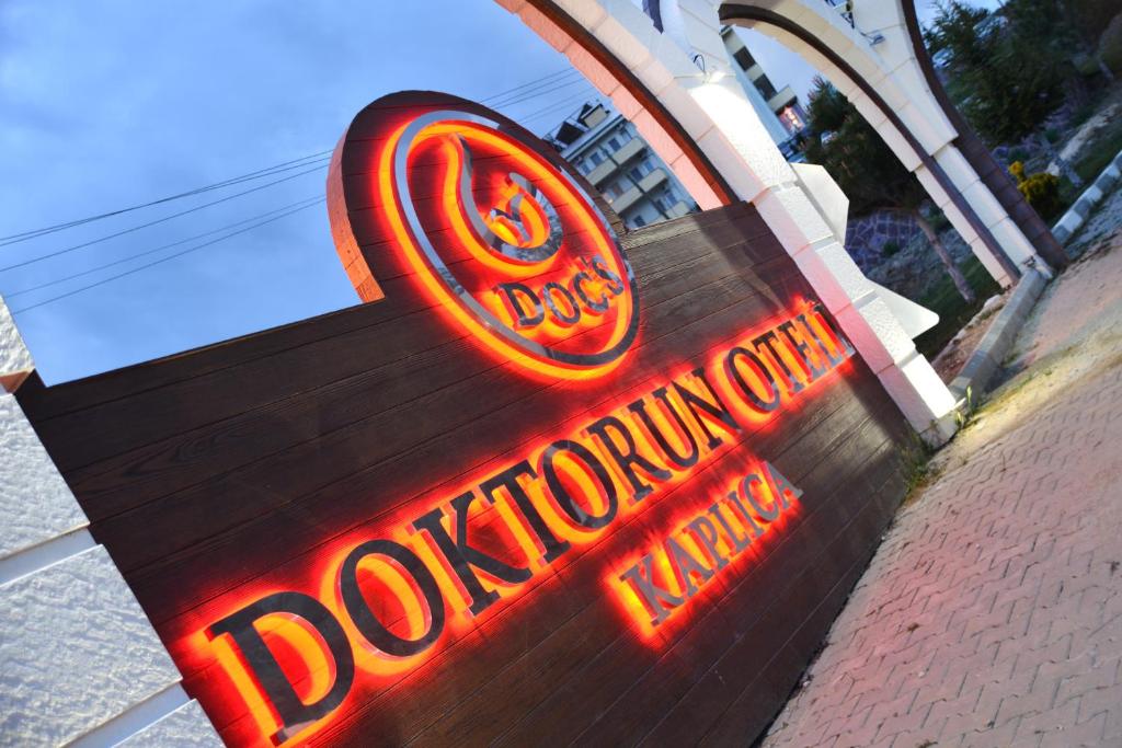 a neon sign for a doughnut shop at Doc's Wellness & Spa Hotel in Haymana