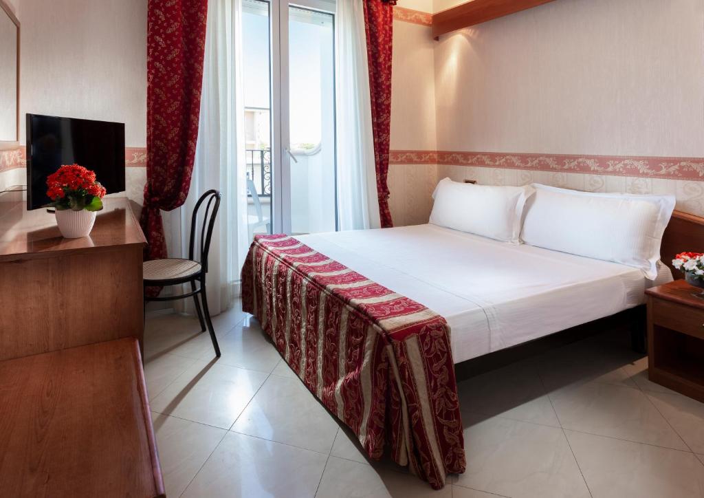 Postel nebo postele na pokoji v ubytování Hotel Gallia Palace