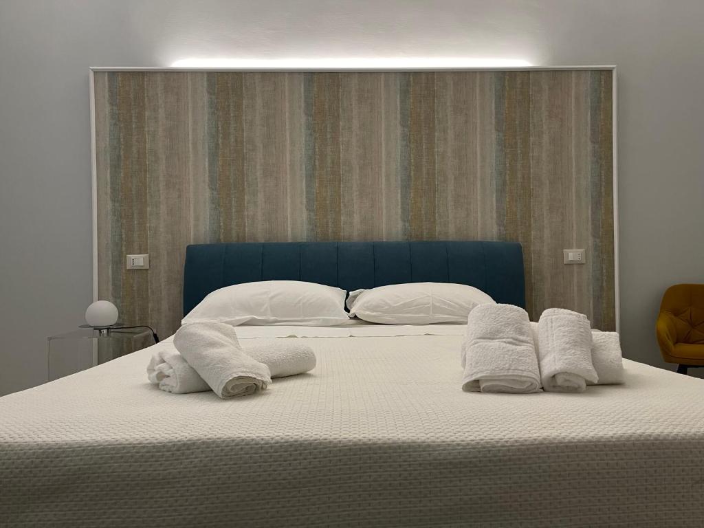 Postel nebo postele na pokoji v ubytování Minioto Rooms
