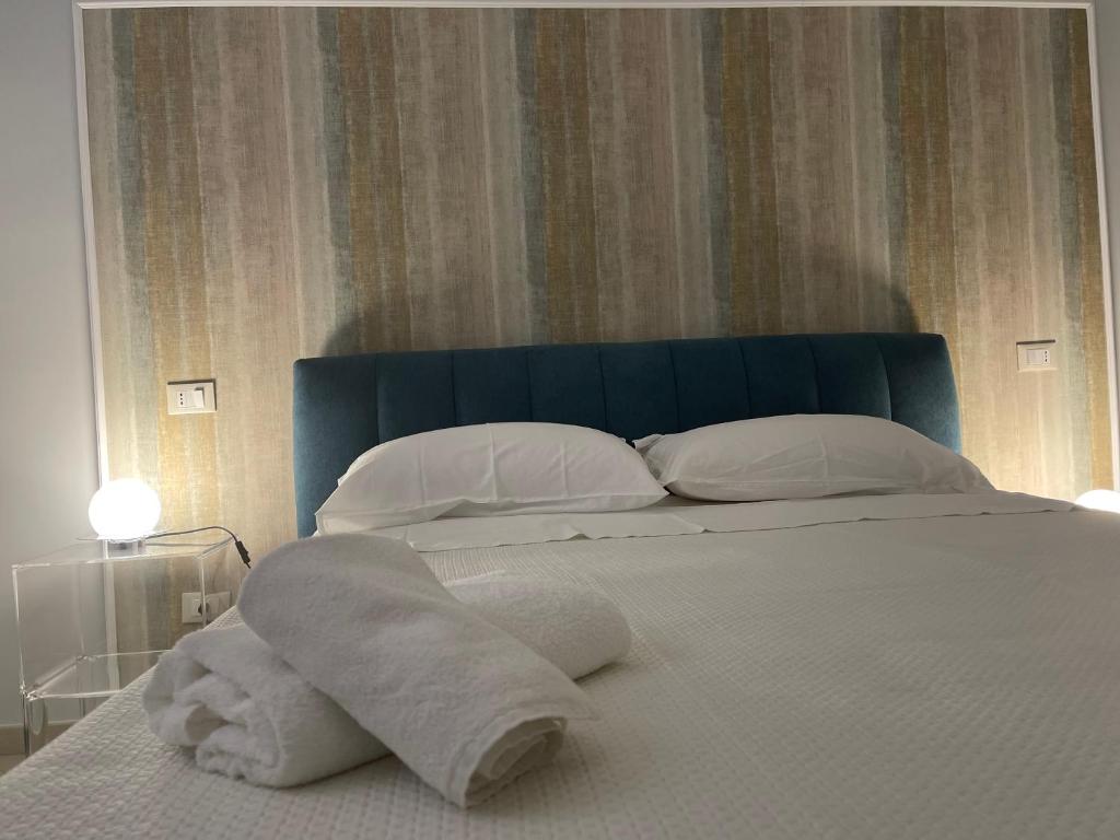Postel nebo postele na pokoji v ubytování Minioto Rooms