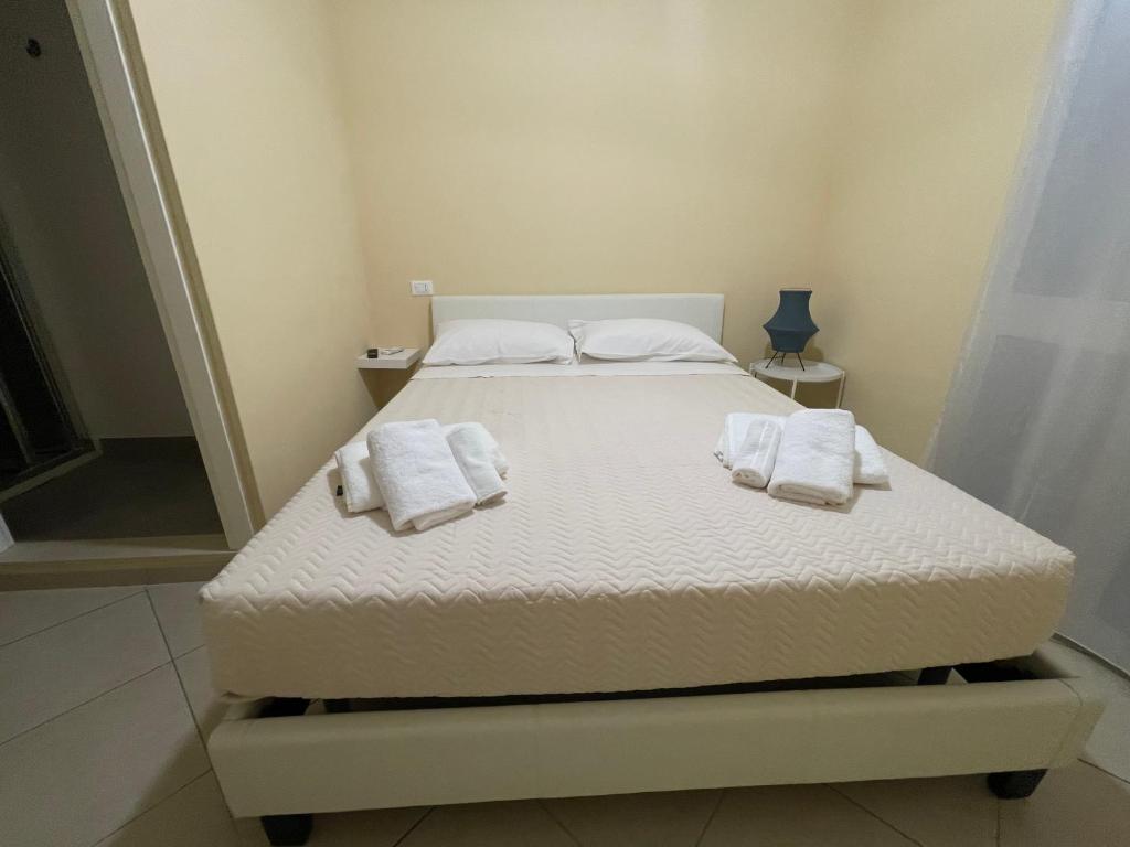 Postel nebo postele na pokoji v ubytování Minioto Rooms