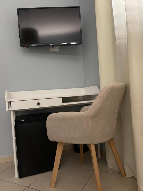 TV a/nebo společenská místnost v ubytování Minioto Rooms