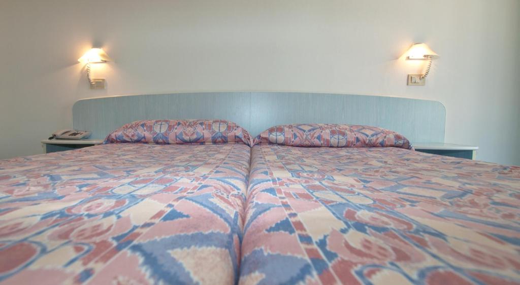 Postel nebo postele na pokoji v ubytování Hotel Park Spiaggia