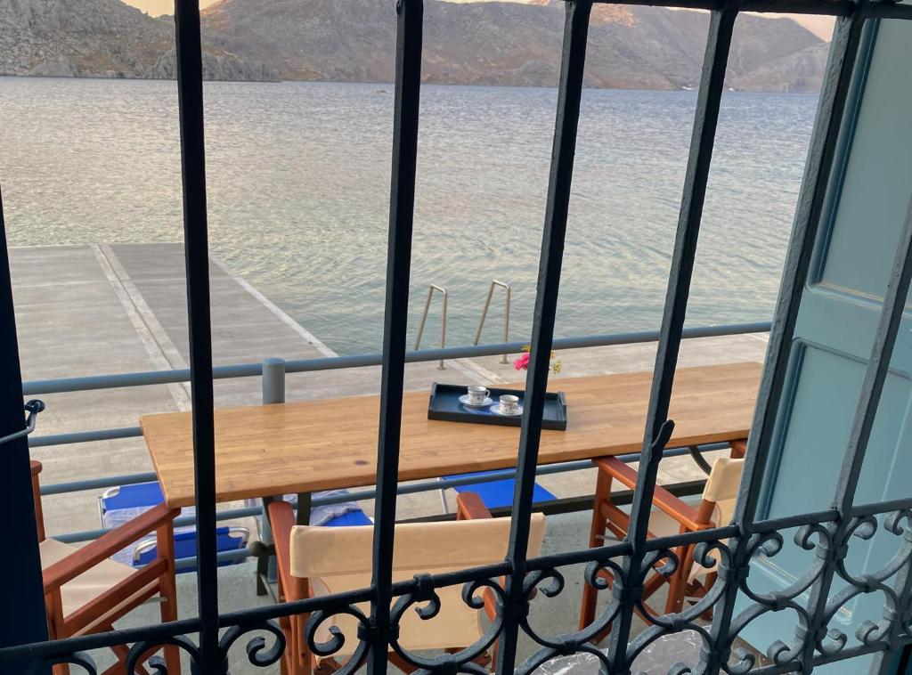 a table on the deck of a boat in the water at Ponente in Symi