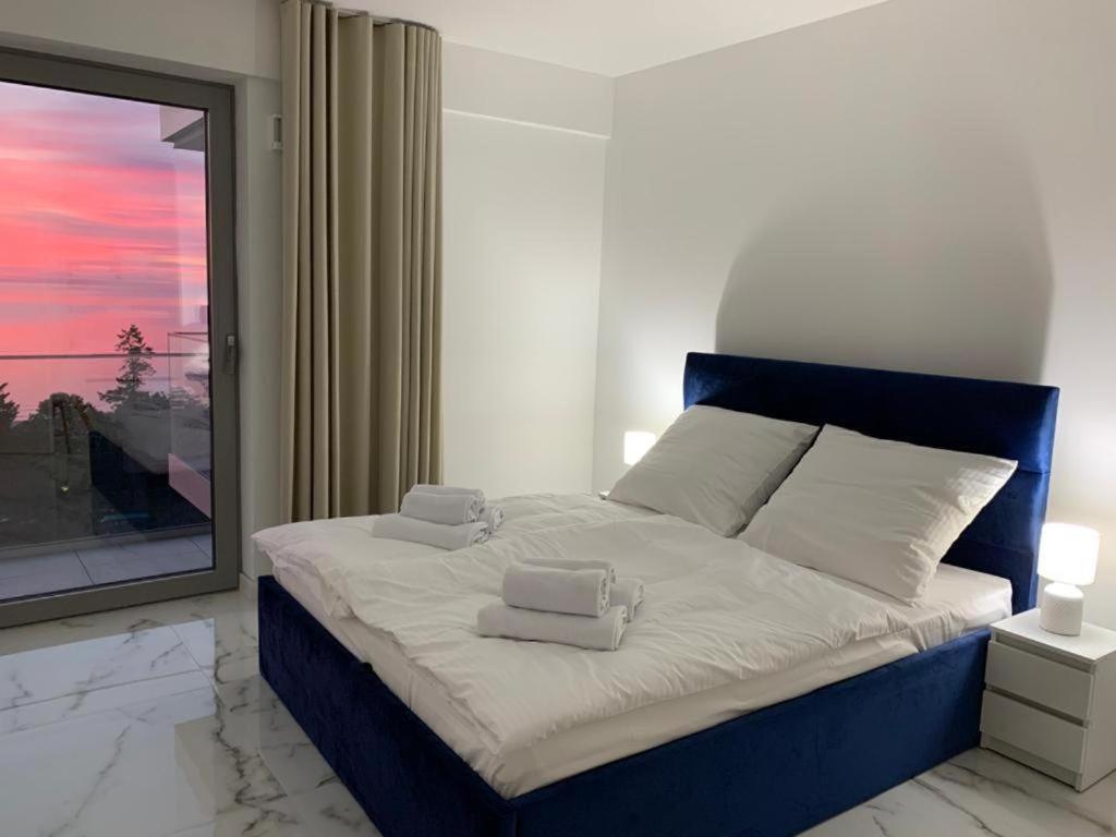 Postel nebo postele na pokoji v ubytování Fischer Apartments