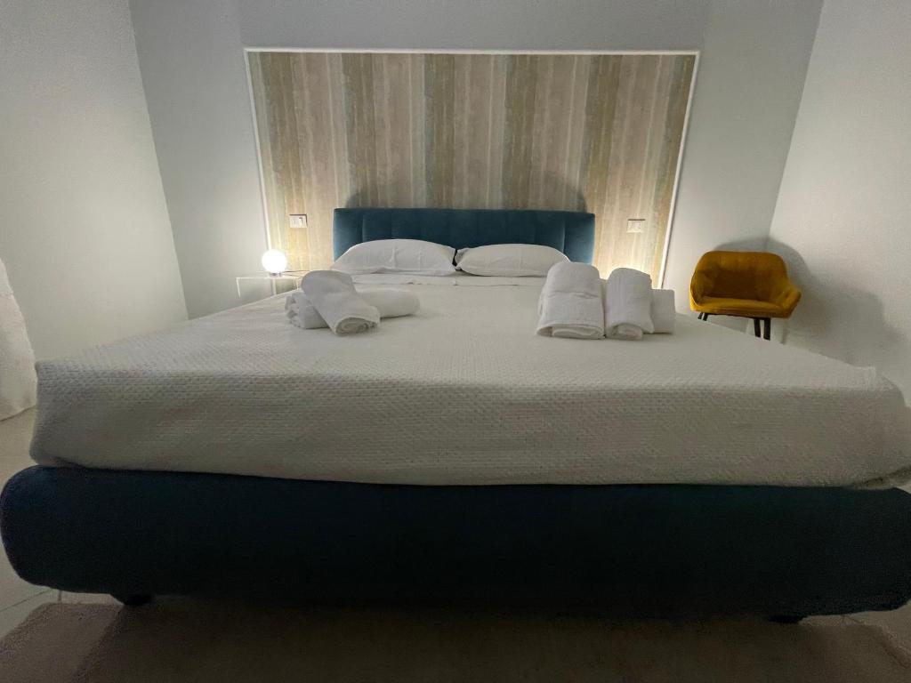 Postel nebo postele na pokoji v ubytování Minioto Rooms