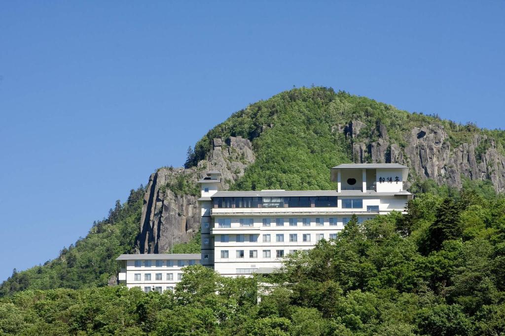 a building on the side of a mountain at Choyo Tei in Kamikawa