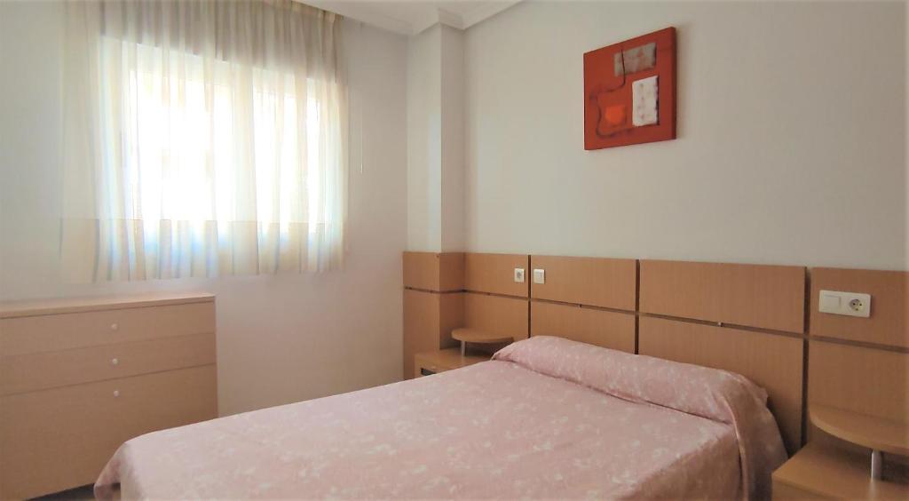 A bed or beds in a room at ACV - Costa Azahar I-2ª Linea Planta 2 Norte