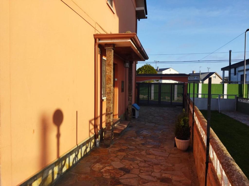 a hallway of a house with a fence at A Pedriña Ribadeo in Ribadeo
