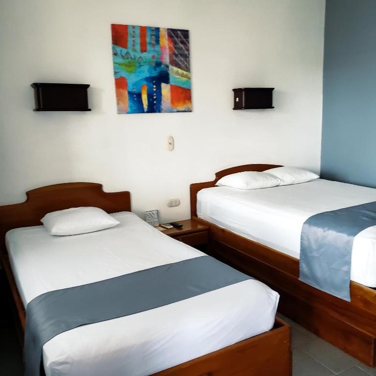 Postel nebo postele na pokoji v ubytování San Bosco Inn