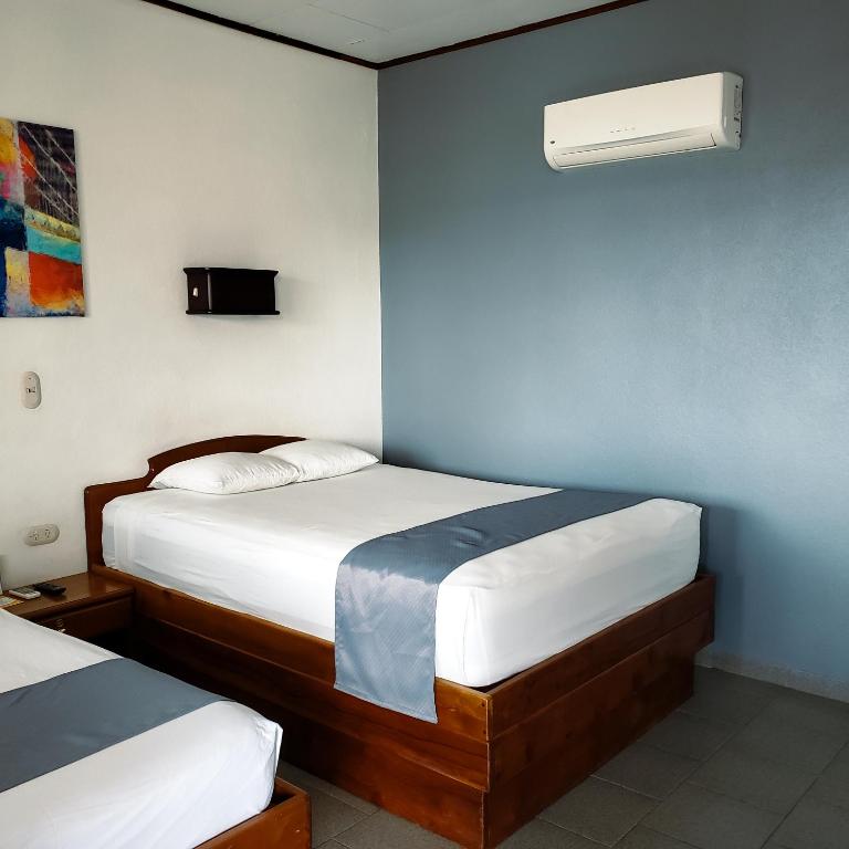 Postel nebo postele na pokoji v ubytování San Bosco Inn