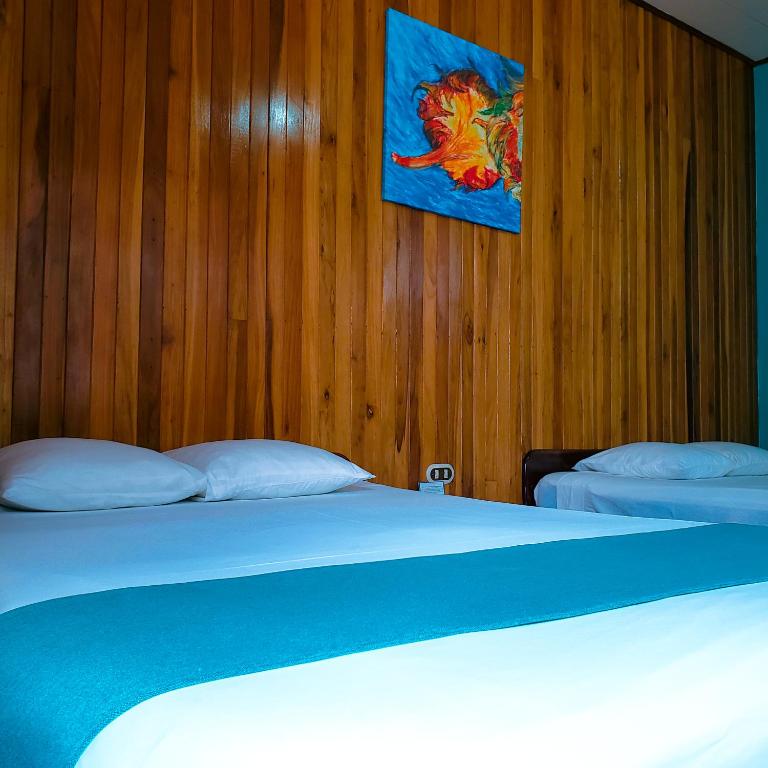 Postel nebo postele na pokoji v ubytování San Bosco Inn
