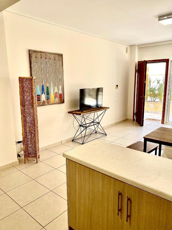 Televízia a/alebo spoločenská miestnosť v ubytovaní PH Marina Apartments