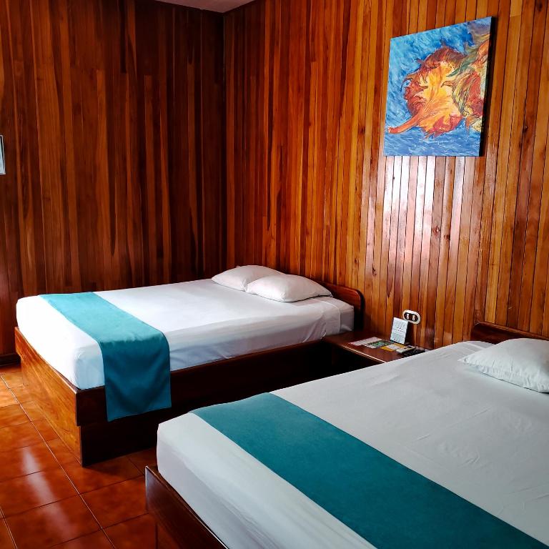 Postel nebo postele na pokoji v ubytování San Bosco Inn