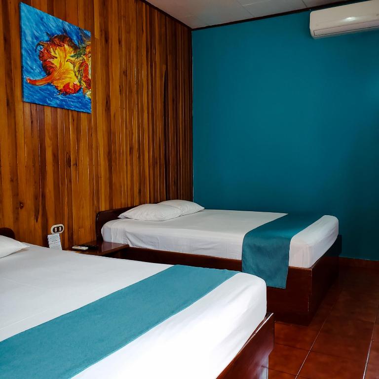 Postel nebo postele na pokoji v ubytování San Bosco Inn