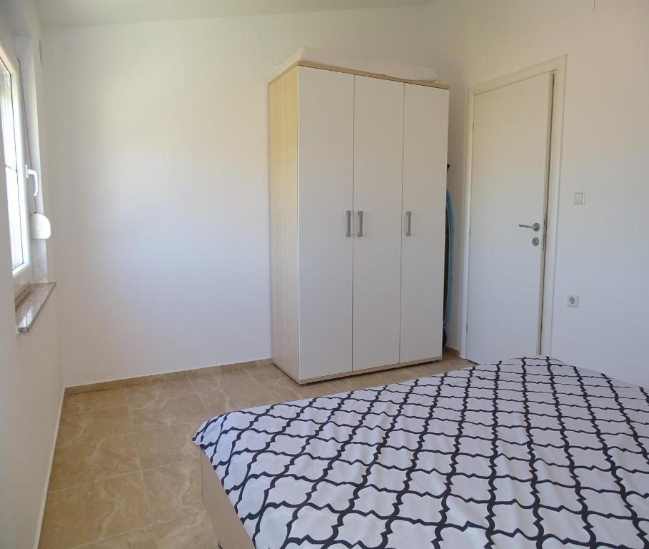 Postel nebo postele na pokoji v ubytování Apartmani David