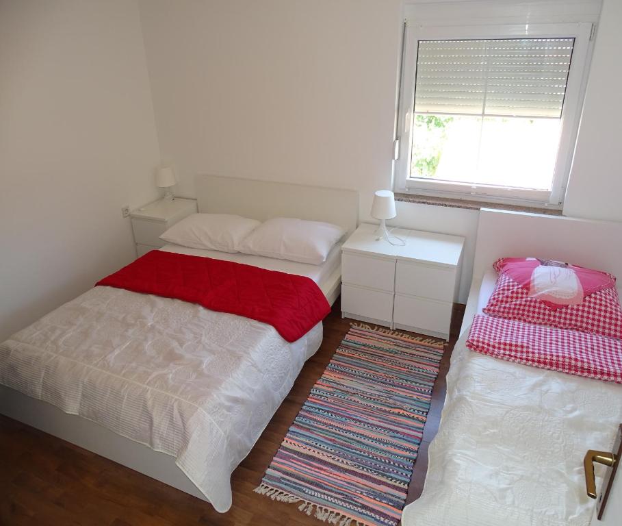 Postel nebo postele na pokoji v ubytování Apartmani David