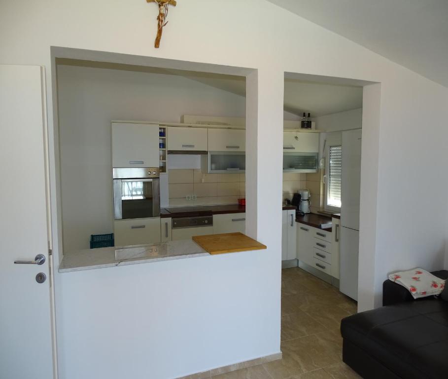 Kuchyň nebo kuchyňský kout v ubytování Apartmani David