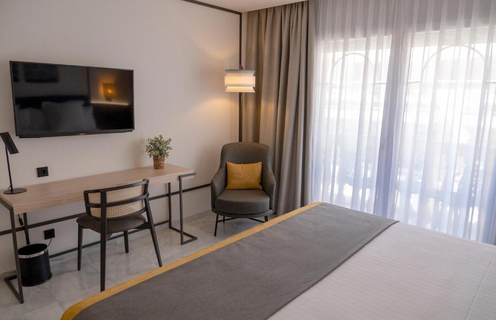 Postel nebo postele na pokoji v ubytování URH Sitges Playa