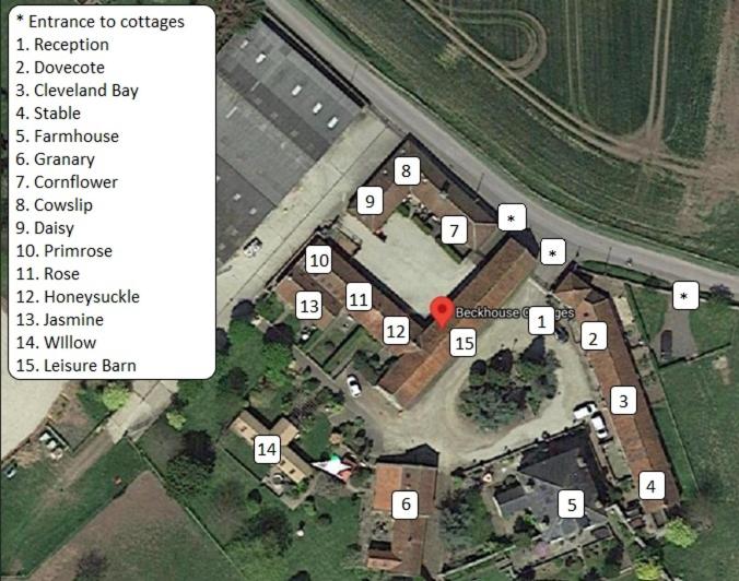 a map of a building with a red circle at Beck House Cottages in Pickering