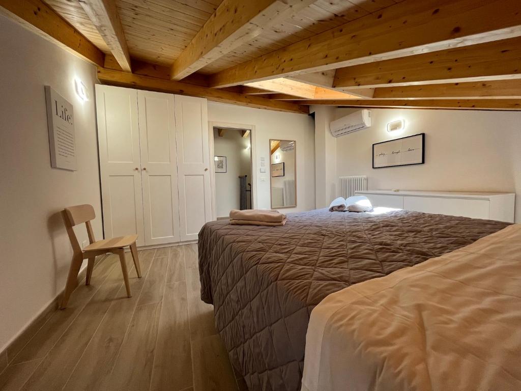 Łóżko lub łóżka w pokoju w obiekcie Anfite Apartments Santa Maria