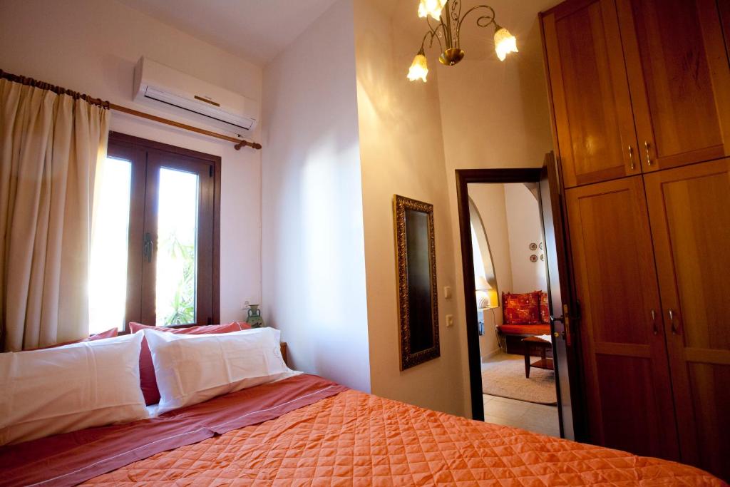 Łóżko lub łóżka w pokoju w obiekcie Nikelen Lindian Exclusive Apartments
