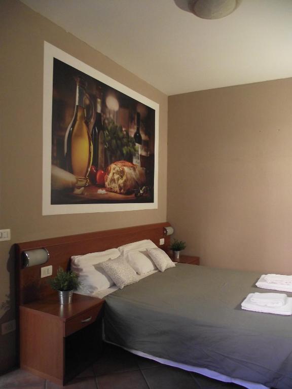 Postel nebo postele na pokoji v ubytování La Corte Albergo