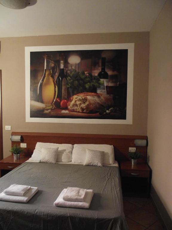Postel nebo postele na pokoji v ubytování La Corte Albergo