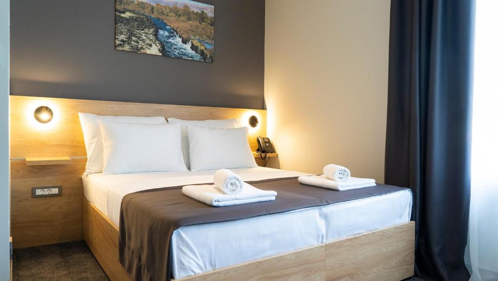 Postel nebo postele na pokoji v ubytování HA Hotel Mostar