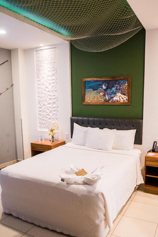 Postel nebo postele na pokoji v ubytování Hotel Clipperton