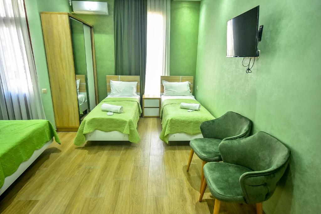 Postel nebo postele na pokoji v ubytování Hotel RANU