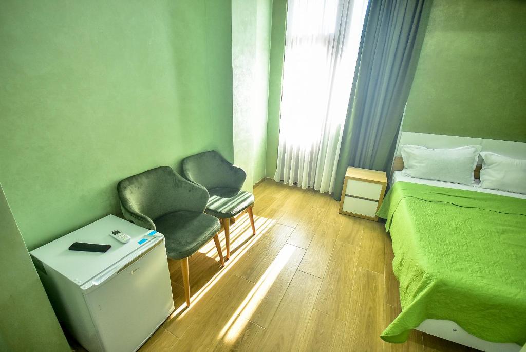Postel nebo postele na pokoji v ubytování Hotel RANU