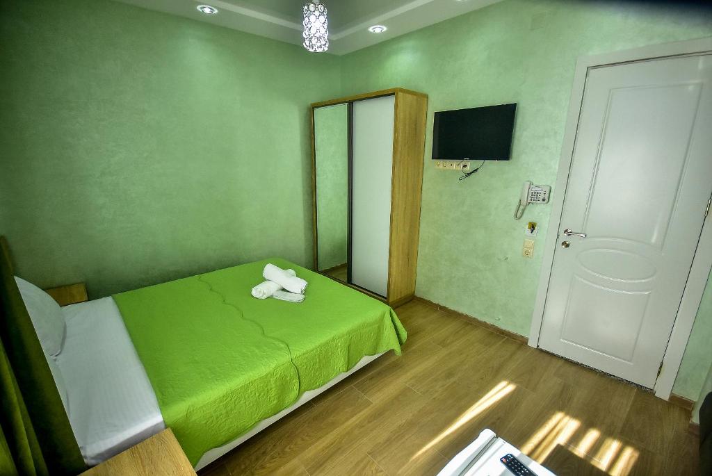 Postel nebo postele na pokoji v ubytování Hotel RANU
