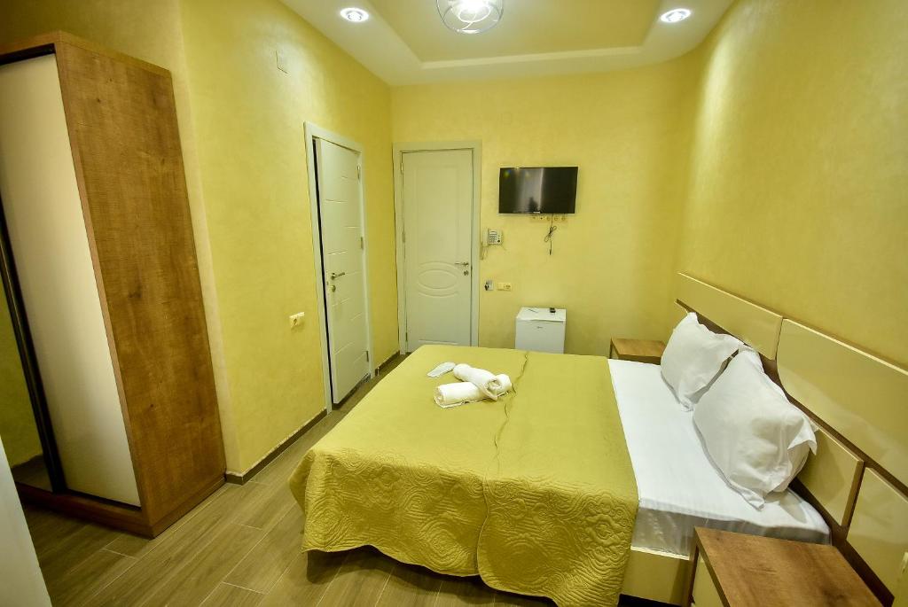 Postel nebo postele na pokoji v ubytování Hotel RANU