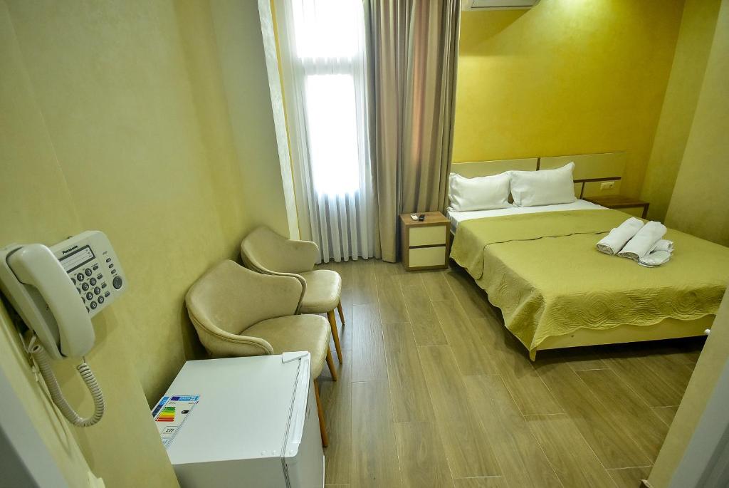 Postel nebo postele na pokoji v ubytování Hotel RANU