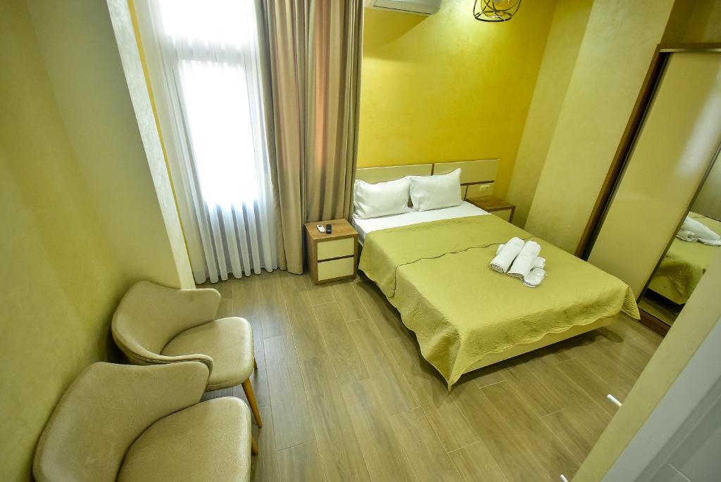 Postel nebo postele na pokoji v ubytování Hotel RANU