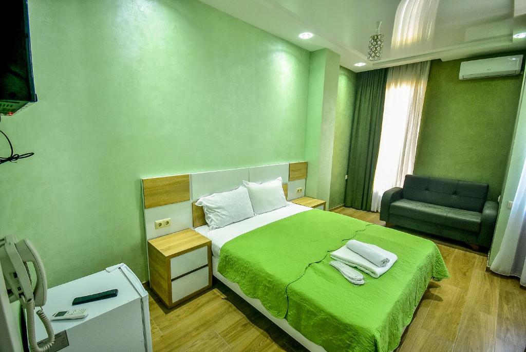 Postel nebo postele na pokoji v ubytování Hotel RANU