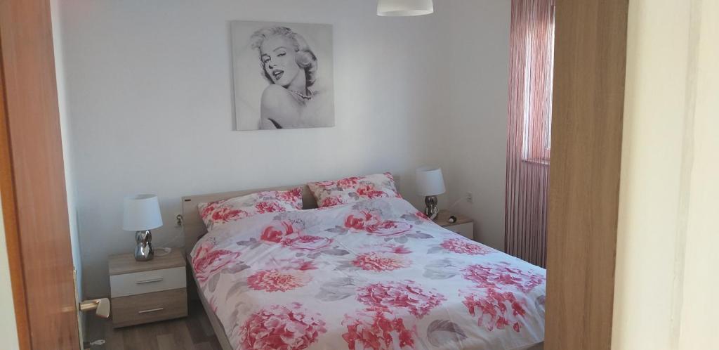 מיטה או מיטות בחדר ב-Apartman Zvončica