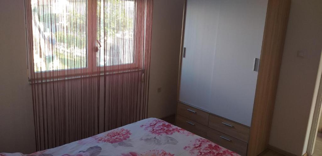 Łóżko lub łóżka w pokoju w obiekcie Apartman Zvončica