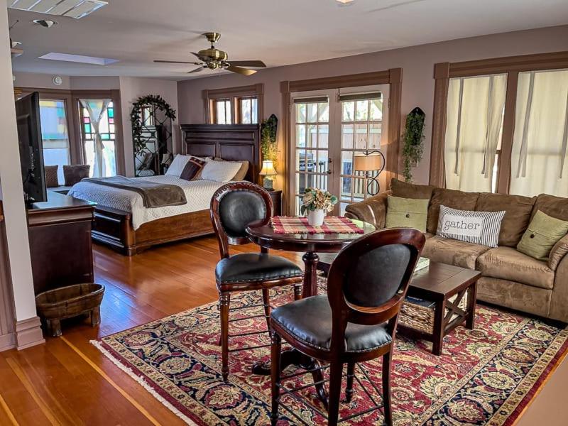 a living room with a bed and a couch at California Cottage: Downtown in Jacksonville