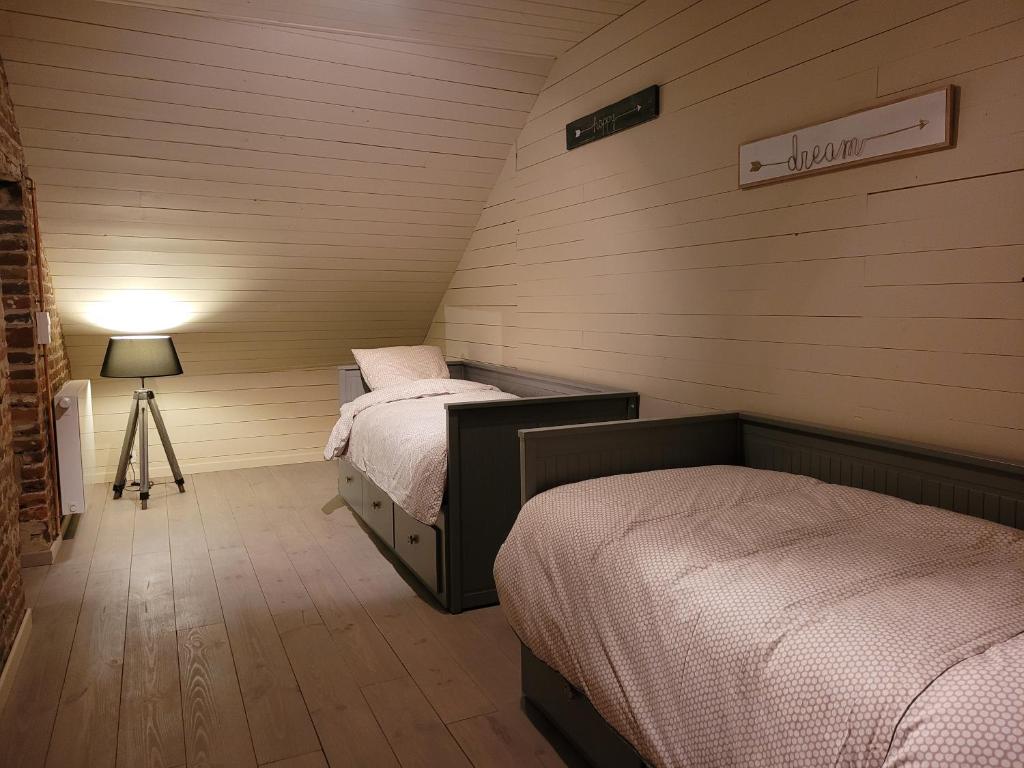 Postel nebo postele na pokoji v ubytování La Cense du Noir Jambon