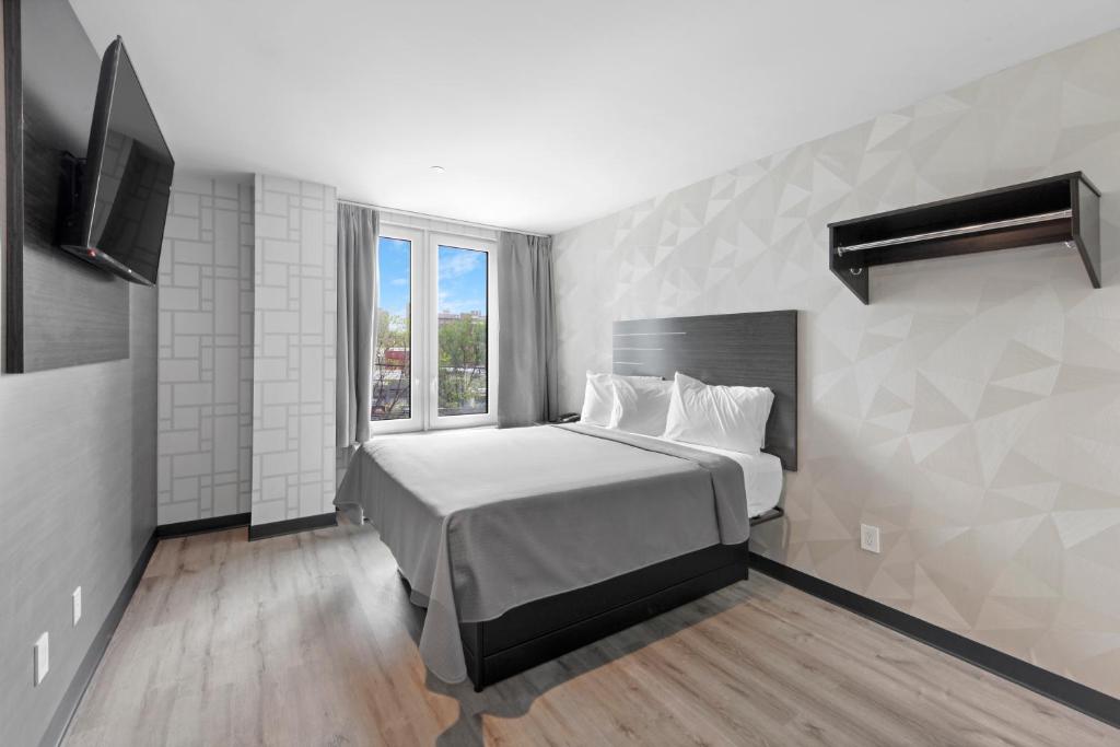 Postel nebo postele na pokoji v ubytování Hotel 365 Bronx - Yankee Stadium