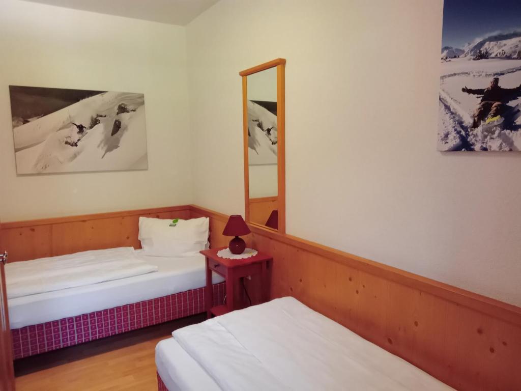 Postel nebo postele na pokoji v ubytování Sportlerhof
