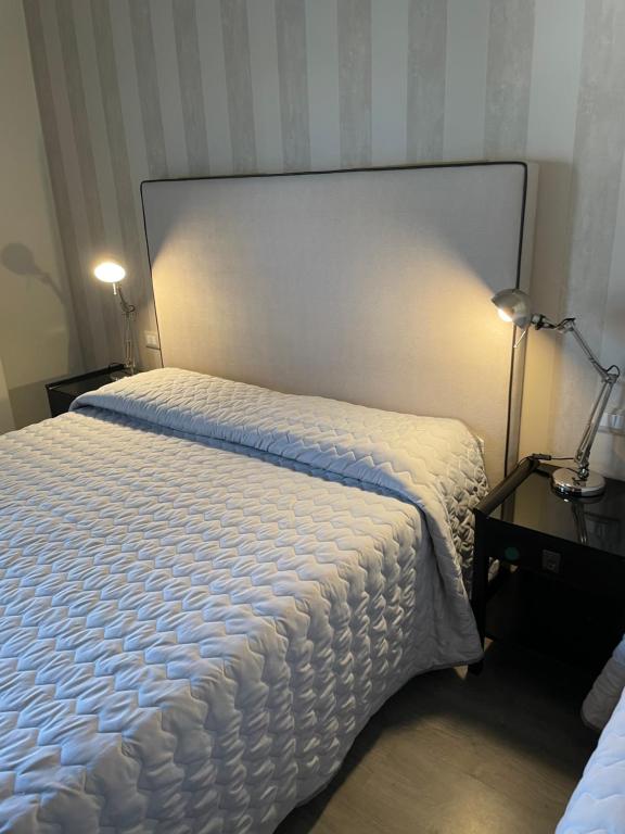 Postel nebo postele na pokoji v ubytování Hotel Vera