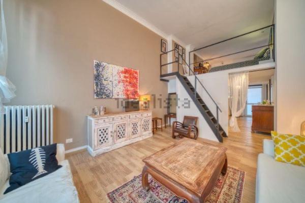 a living room with a couch and a table at San secondo street in Turin