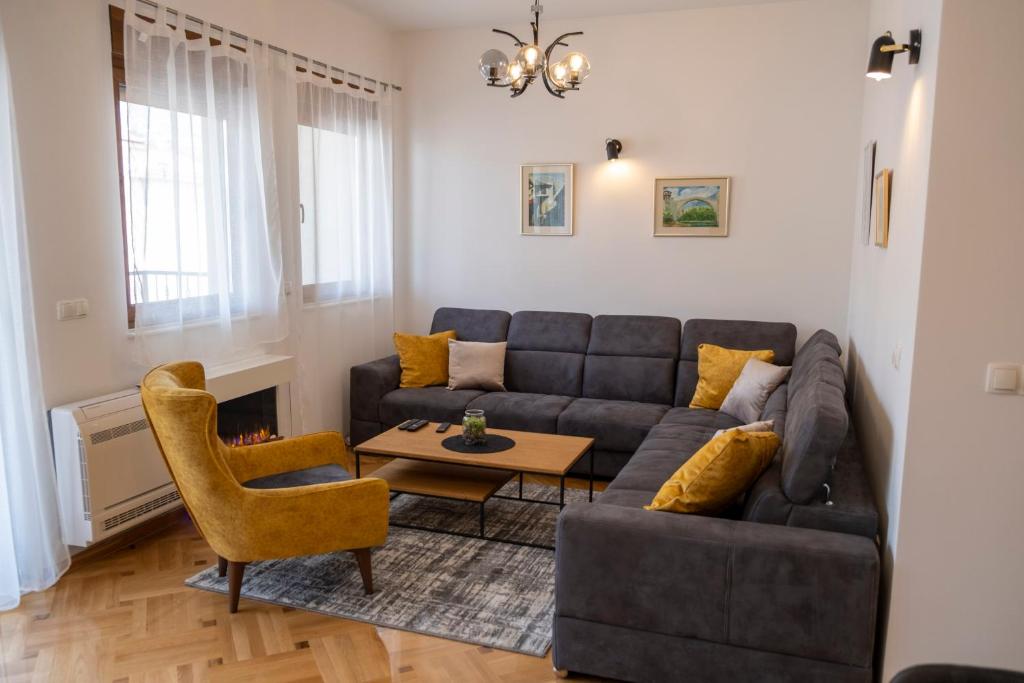 a living room with a couch and a table at Apartment Elite Residence in Mostar