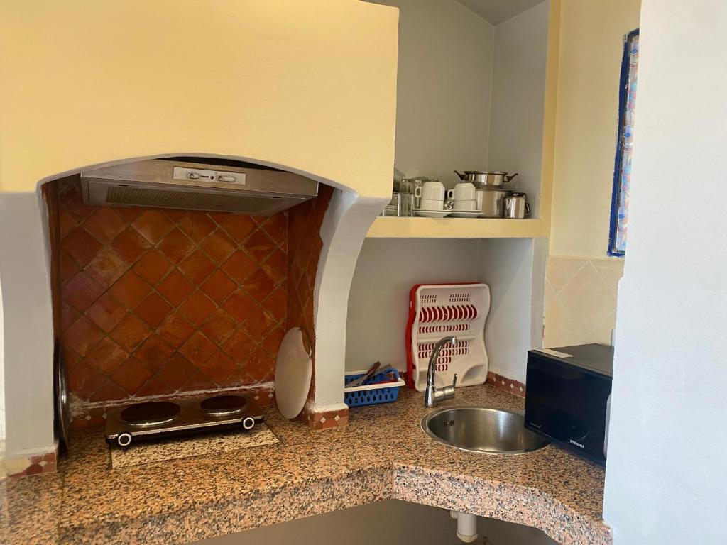 Kuchyň nebo kuchyňský kout v ubytování Hotel Residence Rihab